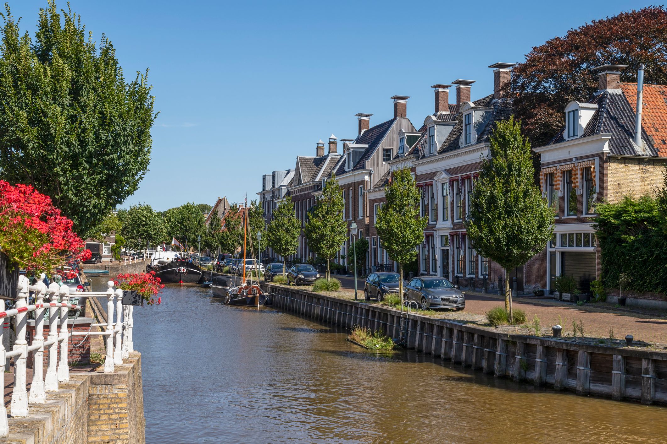 Historic canal houses in the center of Harlingen in Friesland in the Netherlands.