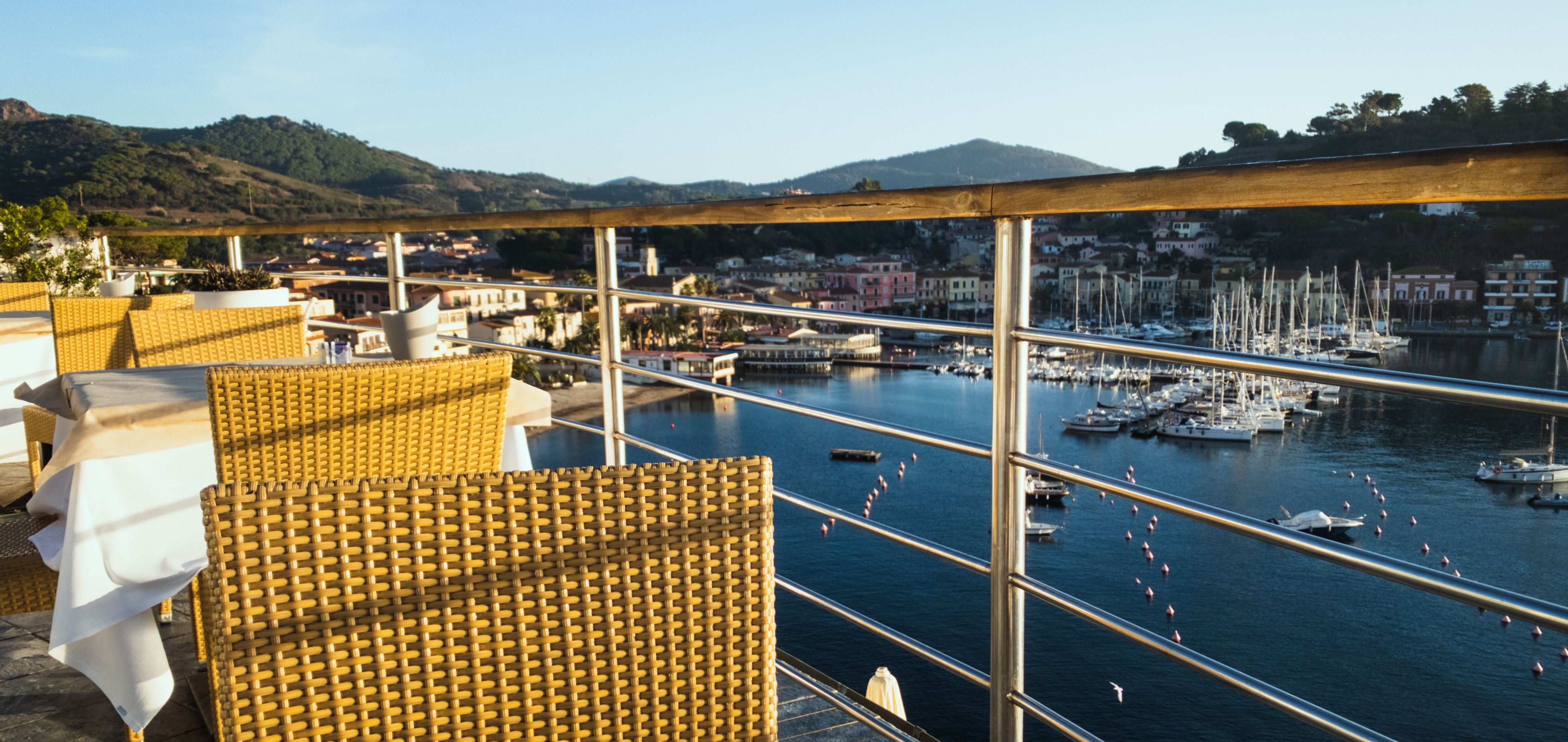 Elegant cafe tables with beautiful view over the marina: Italy, Island of Elba