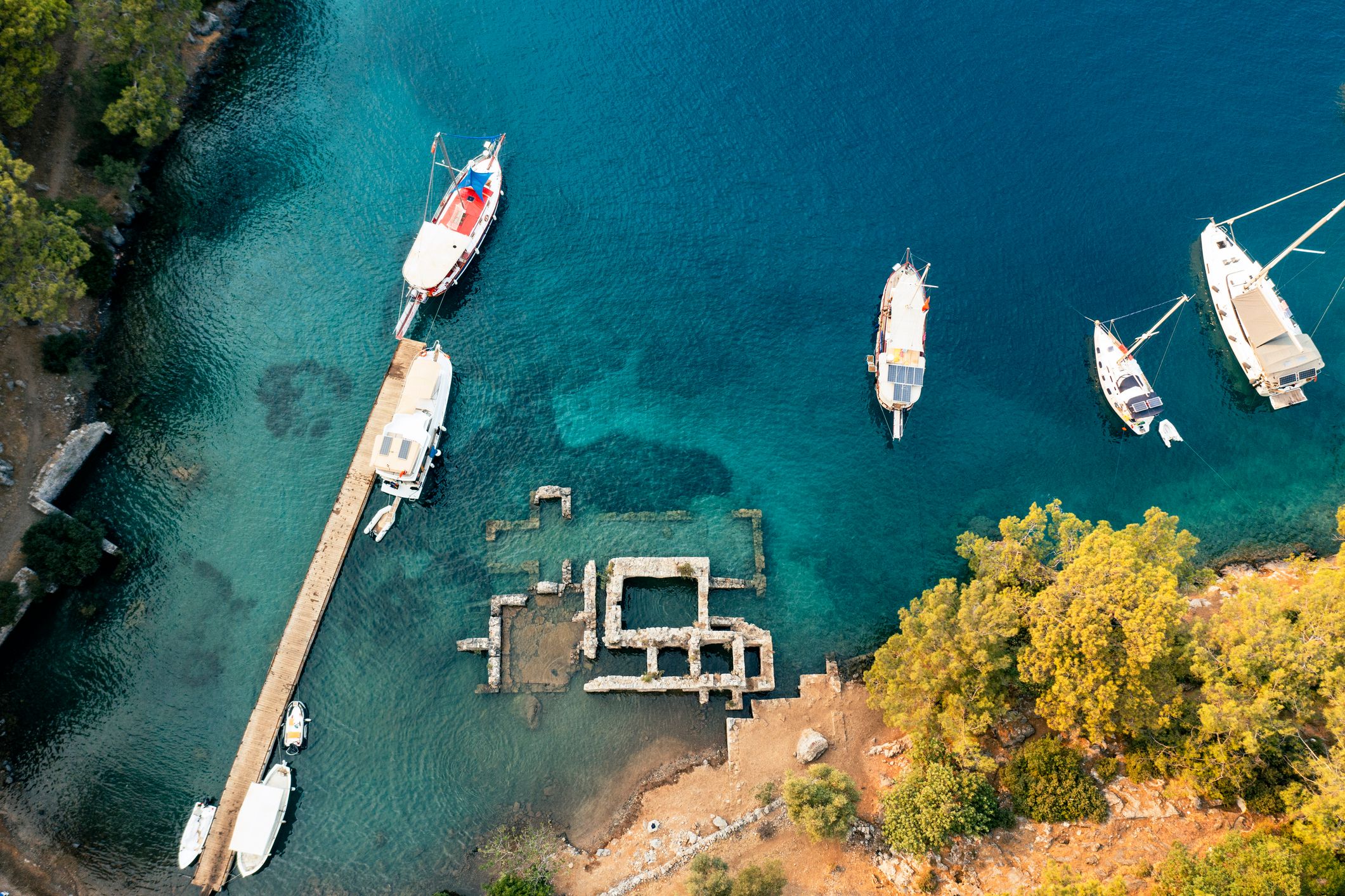 cleopatra's hammam in fethiye gocek bays. This bay still has the ruins of an old Cleopatra's hammam, now under the water. by pine trees and famed for the remaining ruins of Cleopatra's Baths,