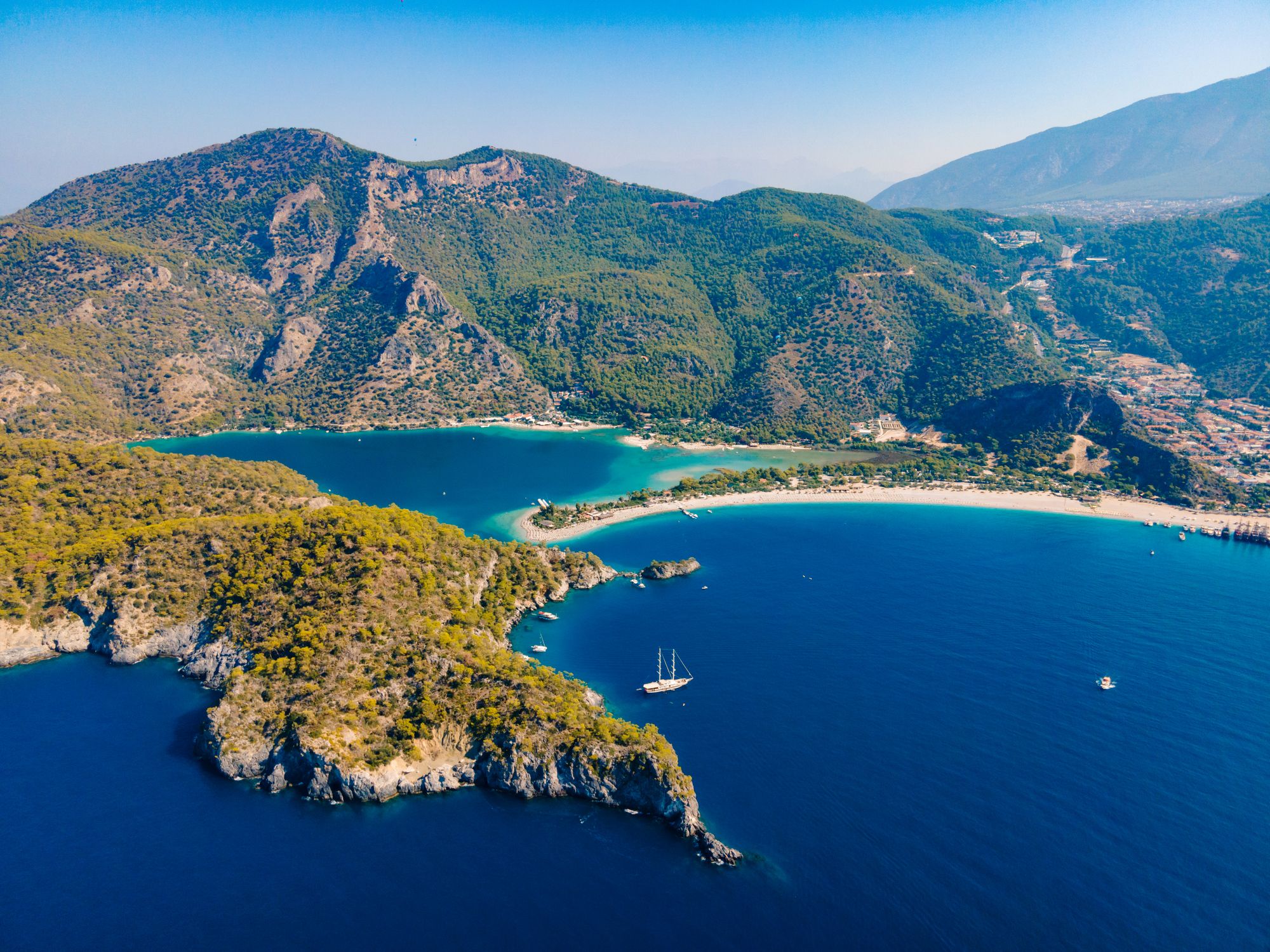 Aerial drone photo of Ölüdeniz, Fethiye, Turkey, showcasing the turquoise waters, picturesque coastline, and beautiful beaches of this popular summer destination.