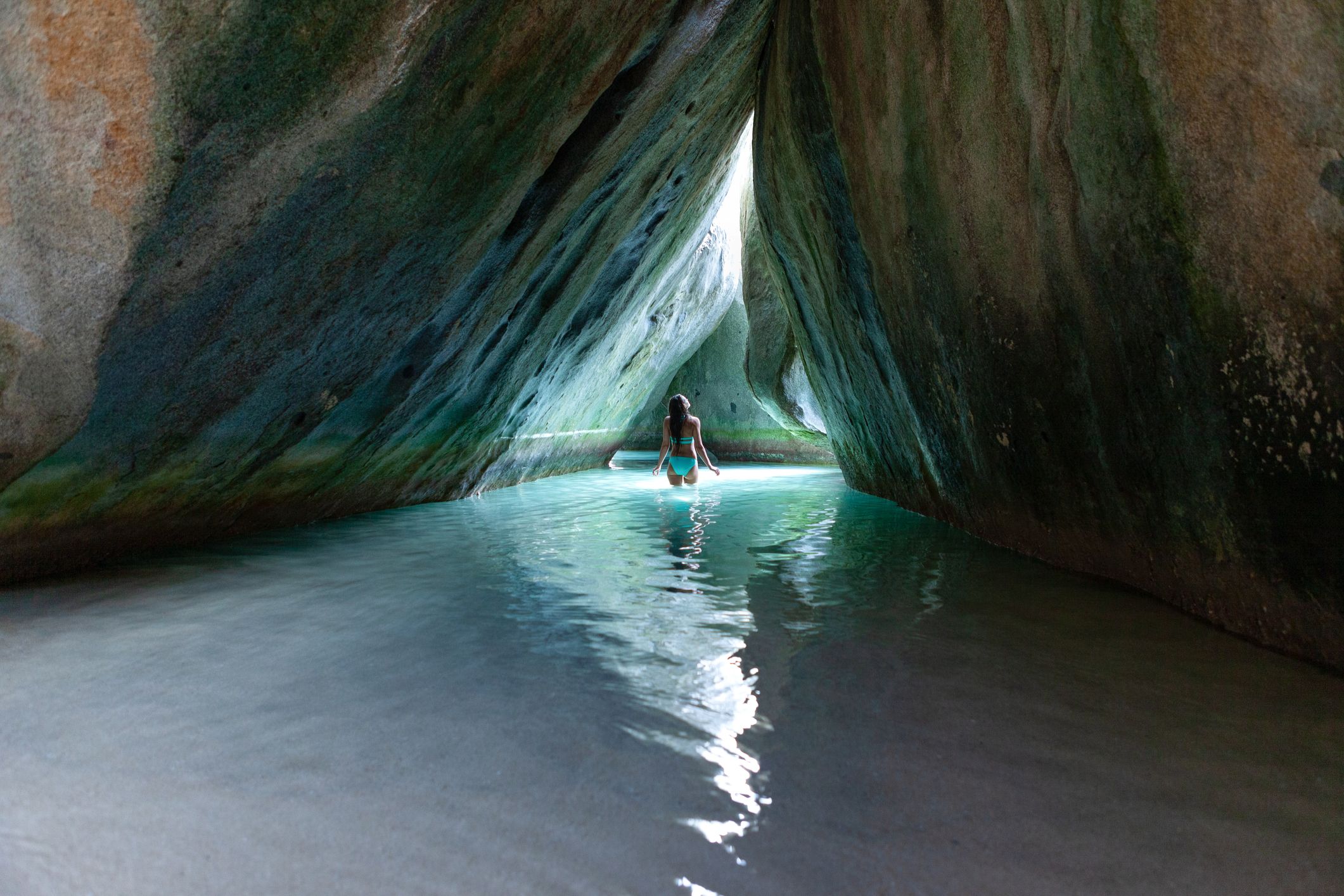 Bikini Woman standing in the cave at the Baths, Virgin Gorda