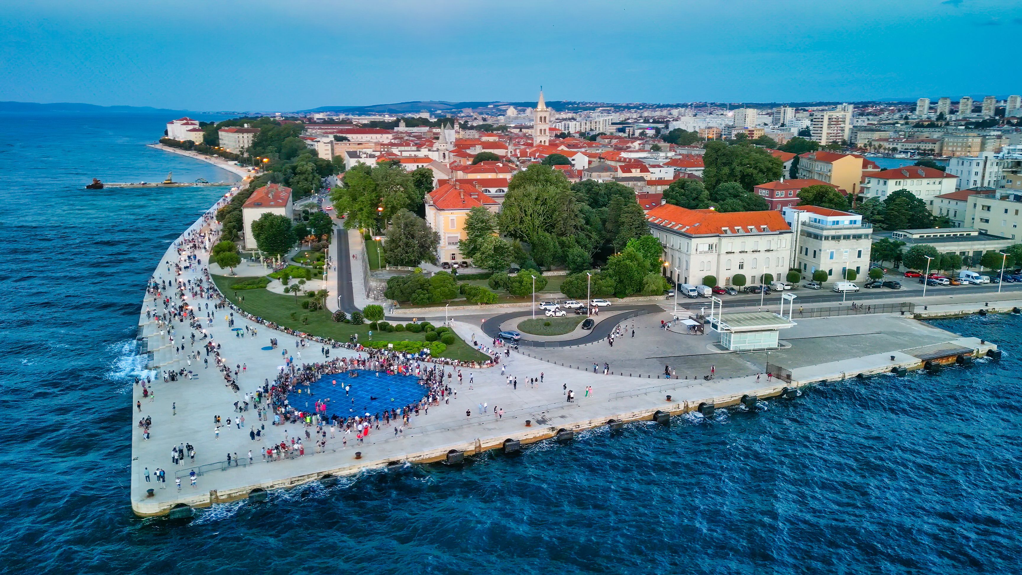 Zadar at sunset, Croatia. Aerial view of promenade with sea organ and greeting to the sun landmarks
