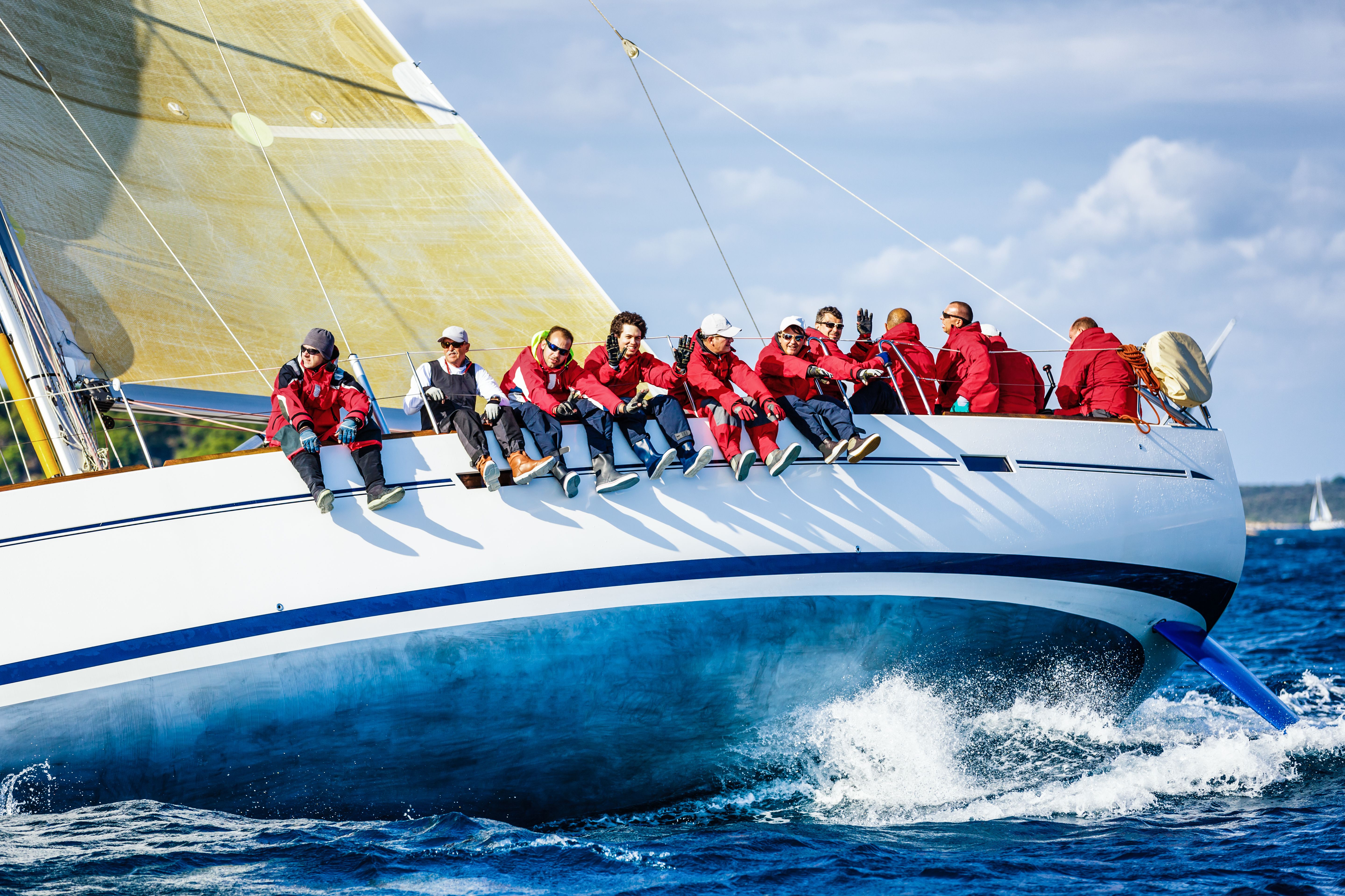 Crew harnessing the free power of the wind