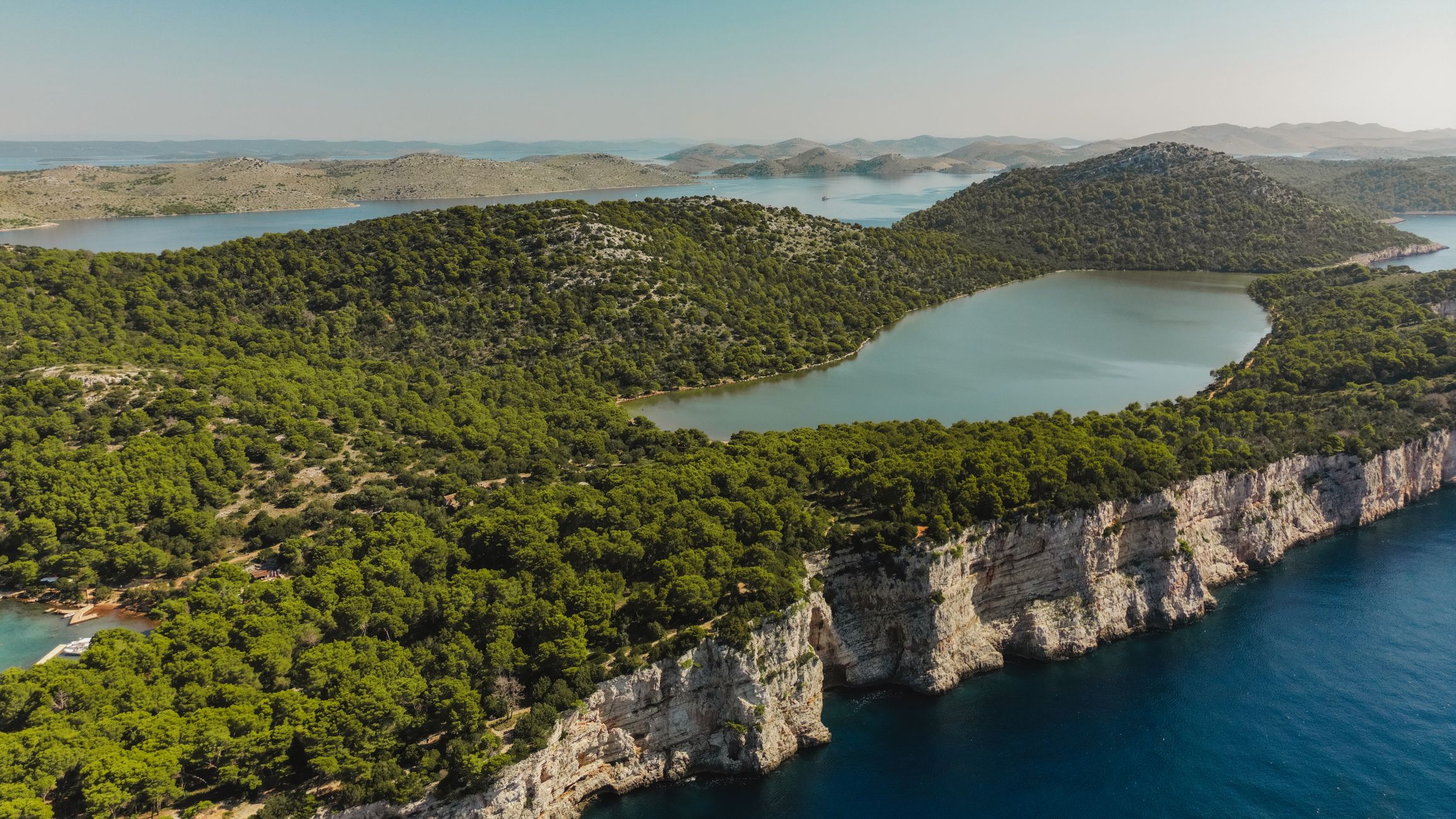 Panoramic drone view of Telascica Nature Park with Dugi Otok island and Mir lake. Kornati archipelago, Adriatic sea, Croatia