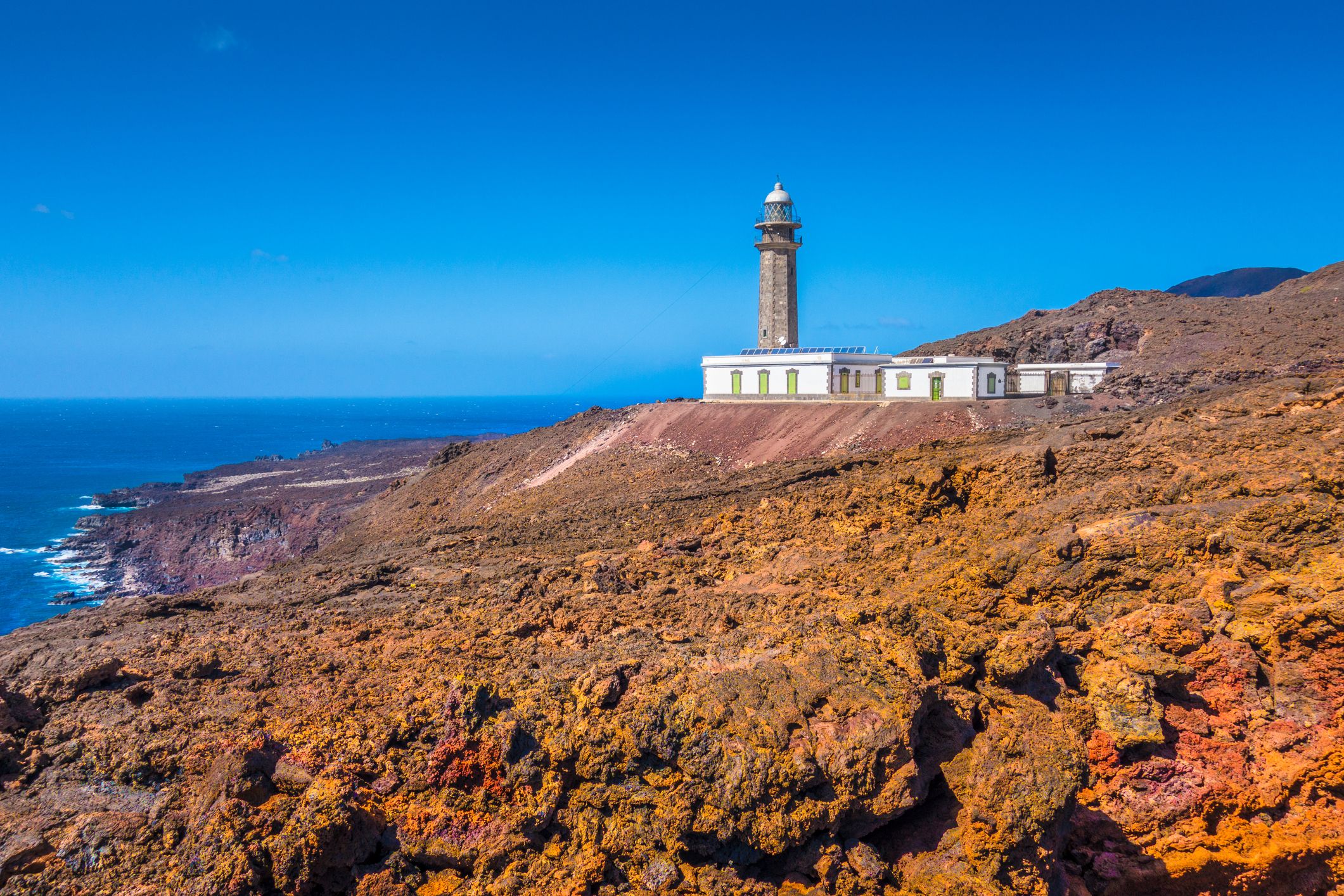 El Faro de Punta Orchilla lighthouse with red volcanic scenery